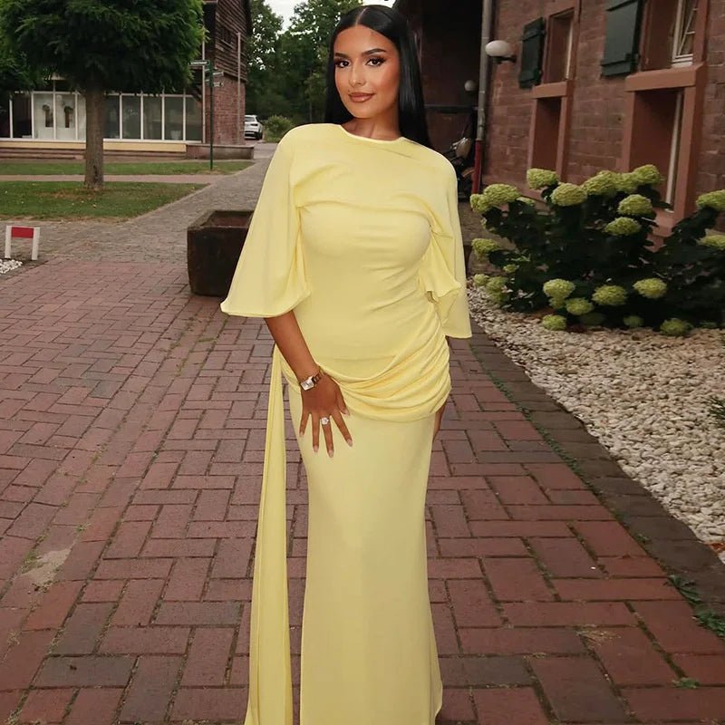 draped yellow maxi dress styled for evening occasions
