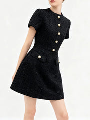 Editorial outfit styling of a tailored mini dress for daytime versatility.