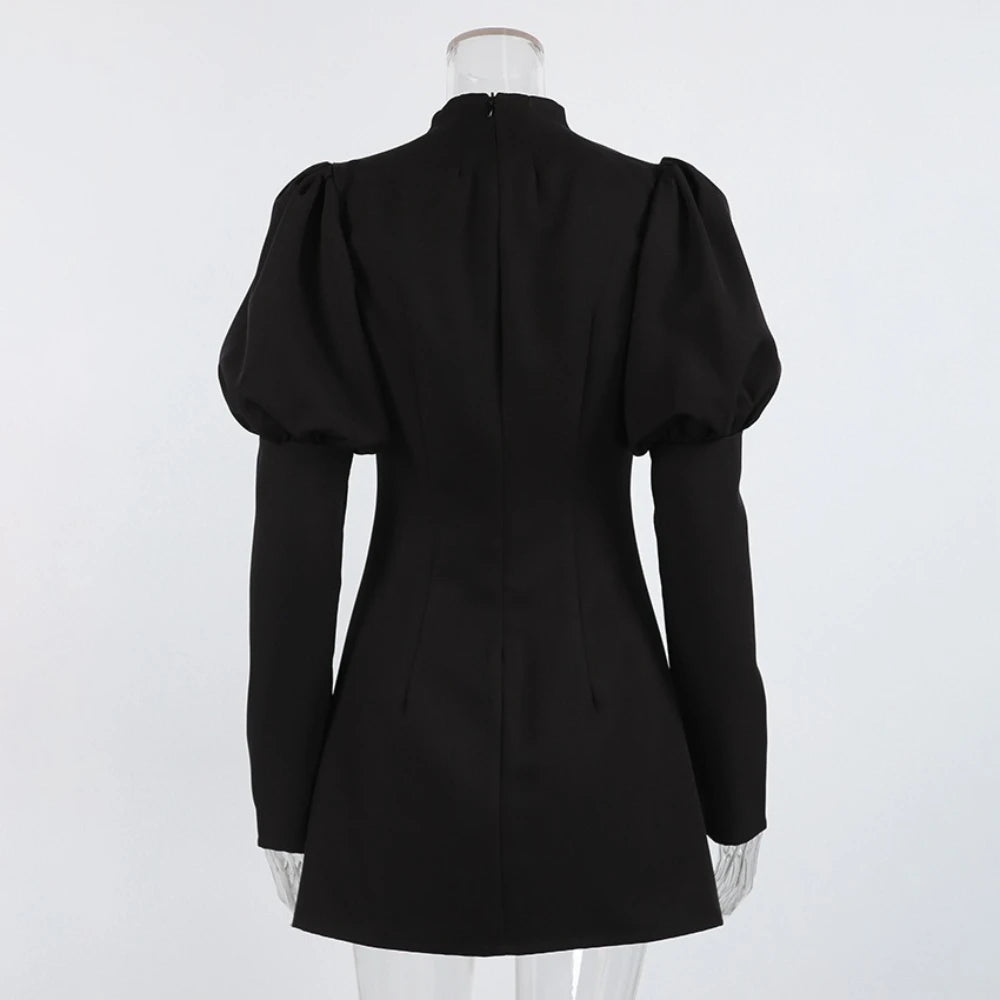 Black puff-sleeve dress on a mannequin against a white background