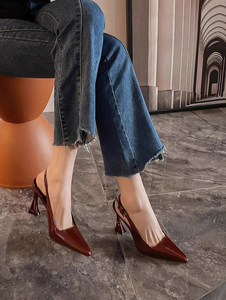 Close-up of brown slingback shoes with pointed toe design