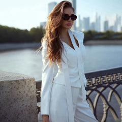 An elegant party look featuring a woman in the slim-fit blazer.