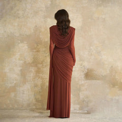 Front angle highlighting the draped bodice and waist shaping, with fluid fabric that falls into a floor-length hemline.