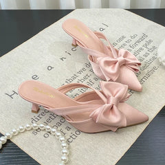Elegant heeled sandals for women’s outdoor parties and brunches on a textured surface