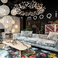Elegant branch ceiling chandelier sparkling above lounge area