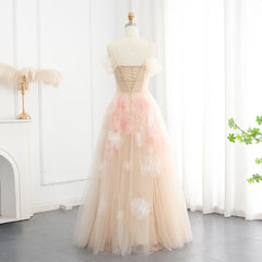 The full length of the off-shoulder gown, showing its flowing A-line silhouette and sweeping train.