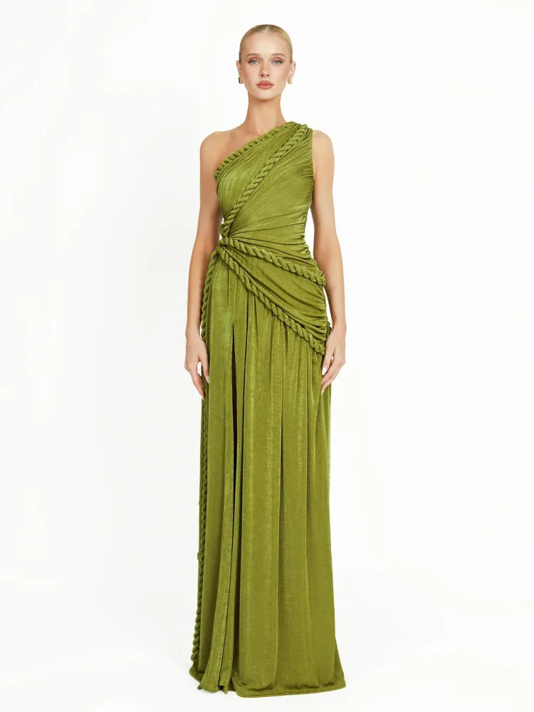 Evening gown styled with pointed heels on a balcony overlooking the sea
