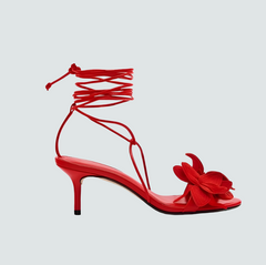 Elegant red stiletto heels styled for evening wear
