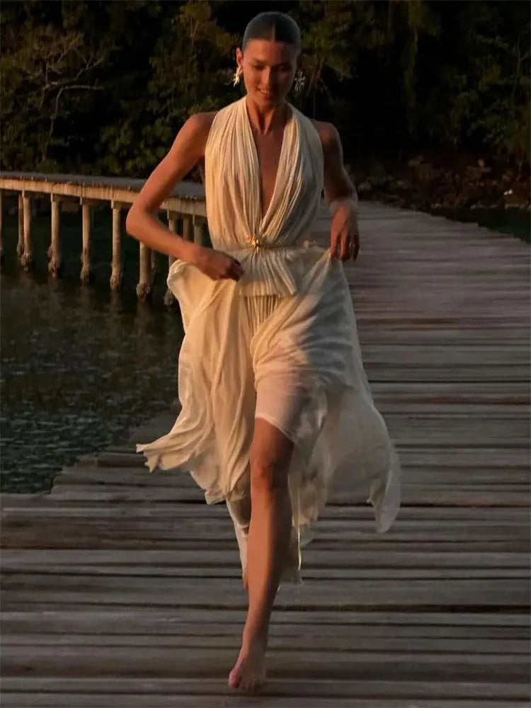 White resortwear set styled for sunset or destination events