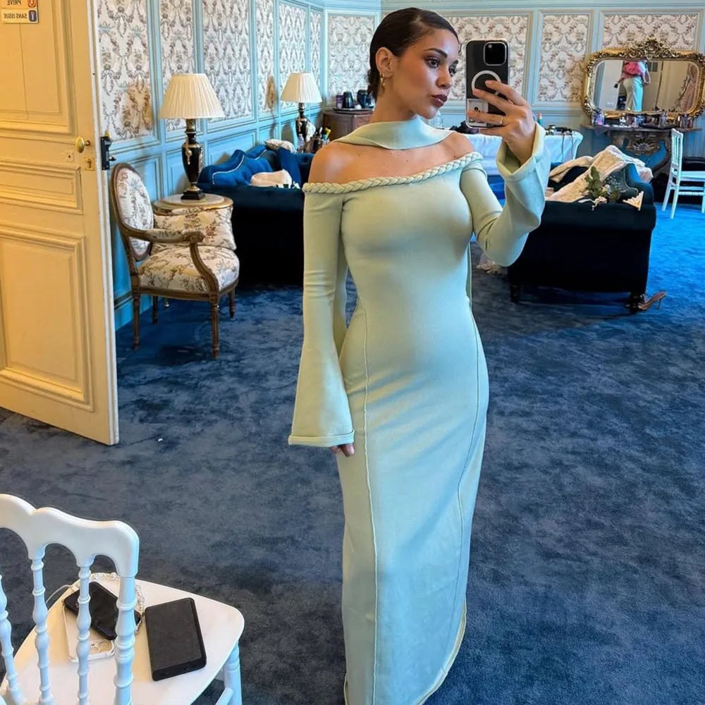 An elegant sheath party gown styled with heels and a clutch.
