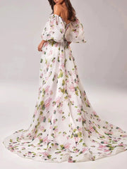 A full-length shot of a slimming puff sleeve dress, styled for a day at the office.