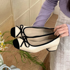 Slip-on beige-black Mary Jane pumps with butterfly knot detail