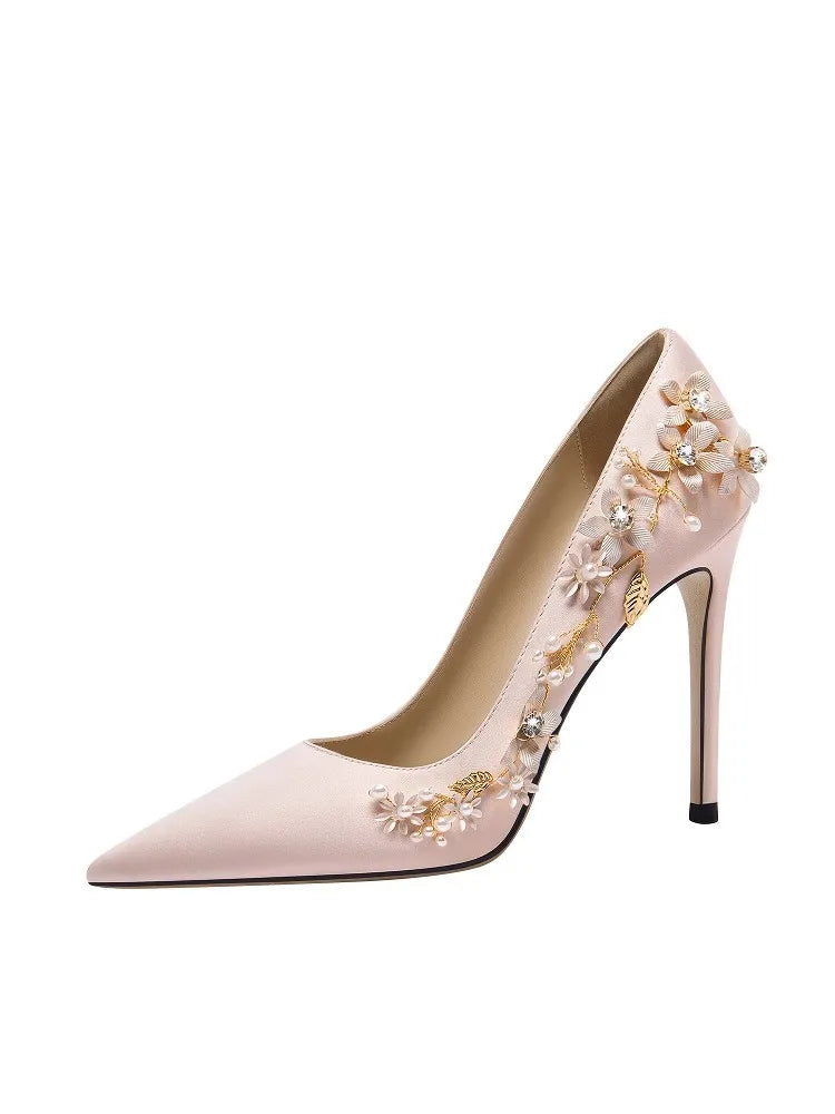 Close-up detail of silk finish and pearl rhinestone embellishment