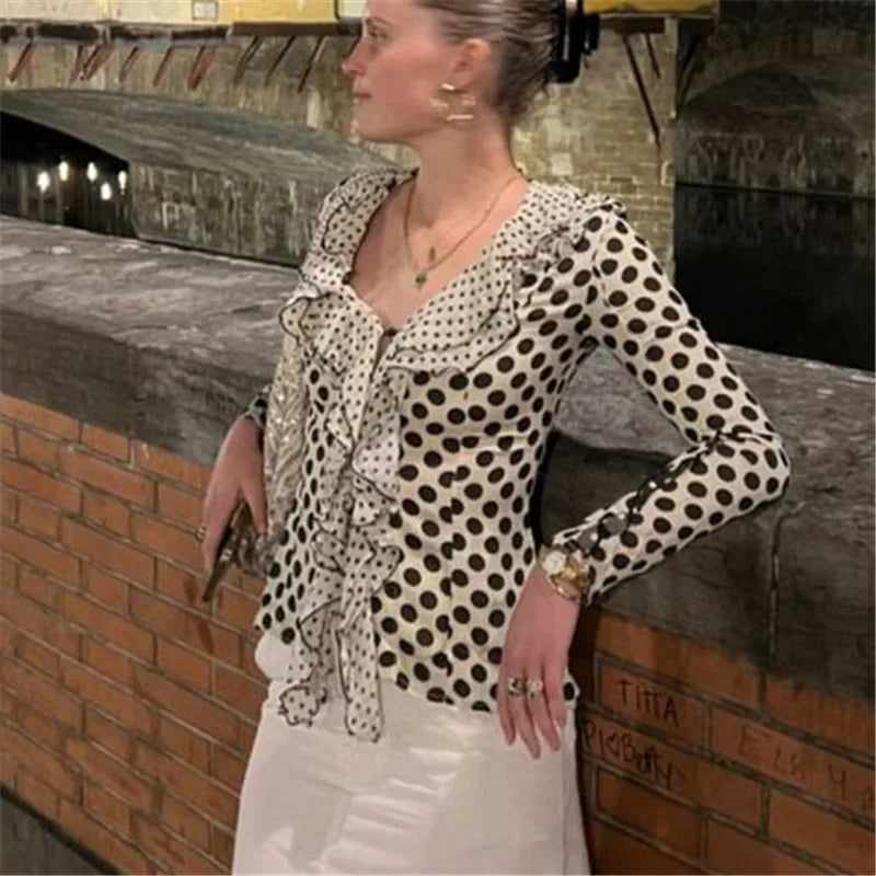 Slim fit classic polka dot top styled with skirt outdoors
