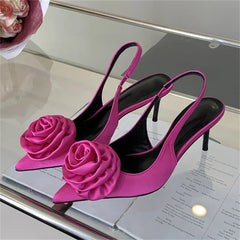 The slip-on mules showing the flower decoration.