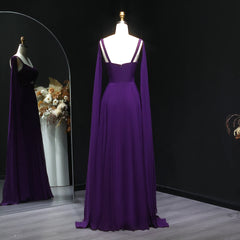 An elegant wedding party gown is shown from the back, highlighting the graceful pleats.