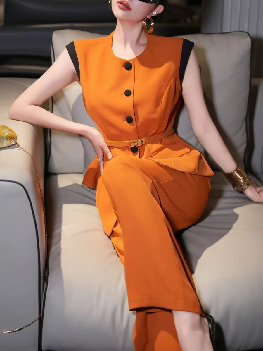 A full-length shot of an elegant women's two-piece set, styled for a day at the office.