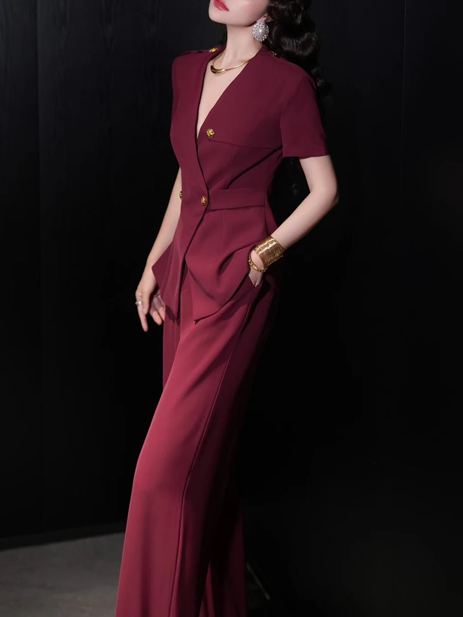 A full-length shot of an elegant women's two-piece set, styled for a day at the office.