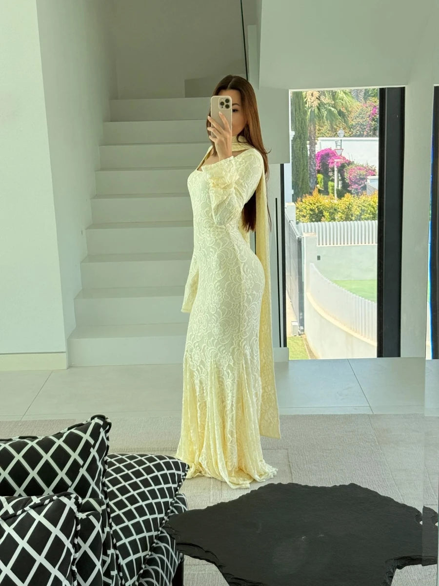 Elegant yellow floor length event dress worn for stylish indoor and outdoor photos