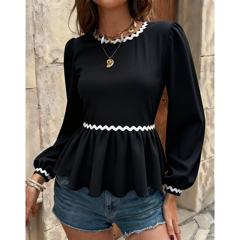 Open-back blouse highlighting soft trim and playful everyday silhouette