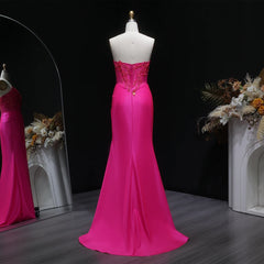 Close-up of appliqué bodice detail on satin mermaid gown