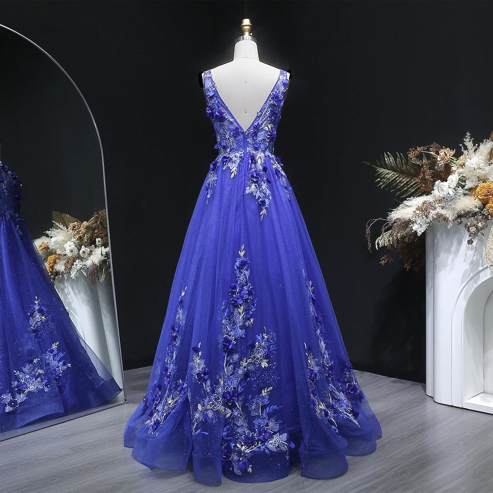 Close-up of floral appliqué bodice detail on layered tulle gown