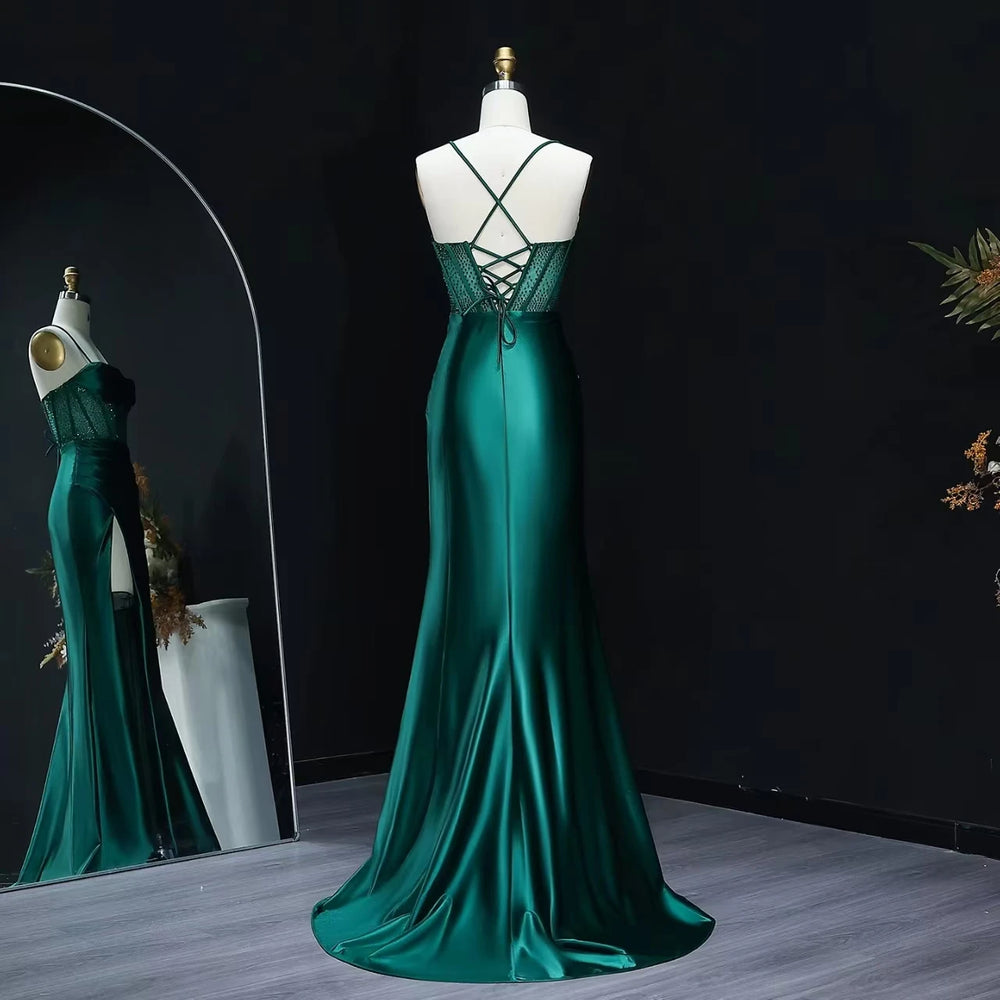 Backless detail on beaded satin mermaid prom gown