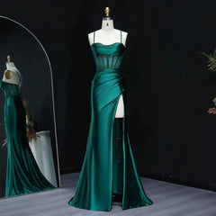 Beaded sweetheart satin mermaid prom gown with a side slit on mannequin