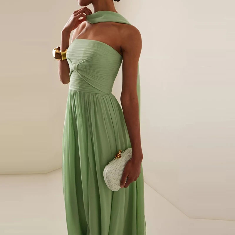 Emerald off-shoulder party dress styled for evening events
