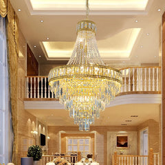 Empire style LED chandelier lighting an elegant double-height foyer
