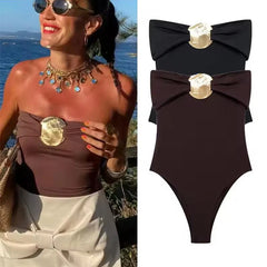 Studio flat lay showing the sculpted neckline fold and centered hardware detail, emphasizing the bodysuit’s sleek, high-street look.