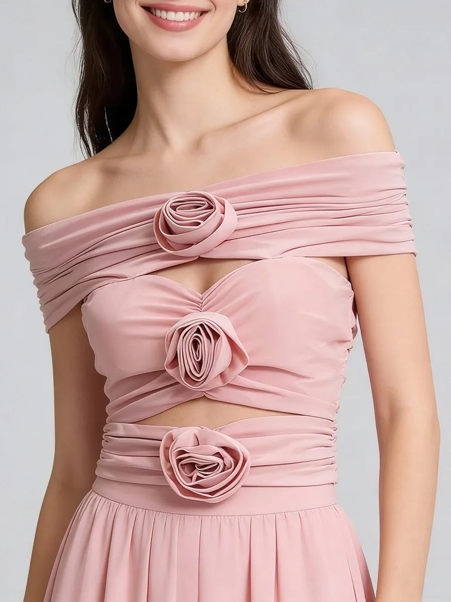 Statement off-shoulder top styled for evening wear with sculptural 3D rosettes