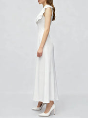 Close-up of the eyelet collar detail on a white summer dress.