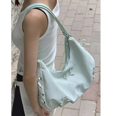 Mint green fairycore shoulder bag with side bow details and zipper closure