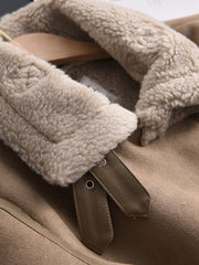 Close-up of a faux leather jacket with a fur collar.