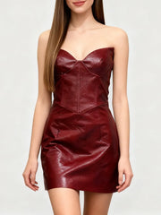 structured neckline showing faux-leather texture, bodice shaping, and smooth surface finish of a mini dress.