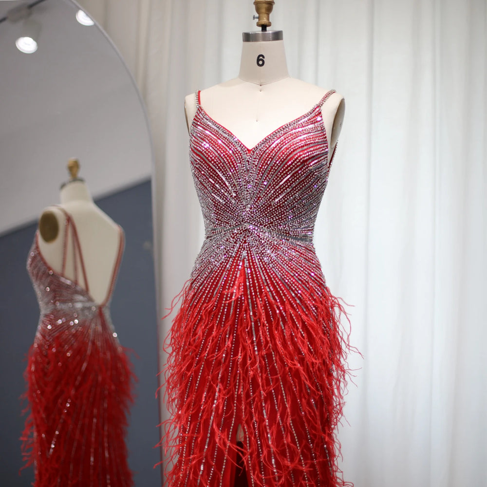 Side profile showing feather embellishments and floor-length silhouette