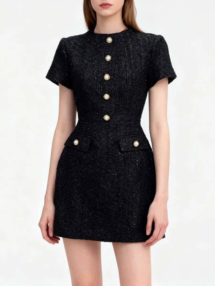 A fit-and-flare mini dress highlighting waist emphasis and soft hem movement.