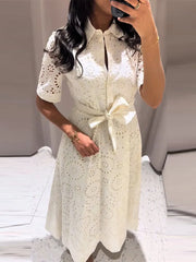 Fit and flare white maxi dress with lapel neckline and cutout details