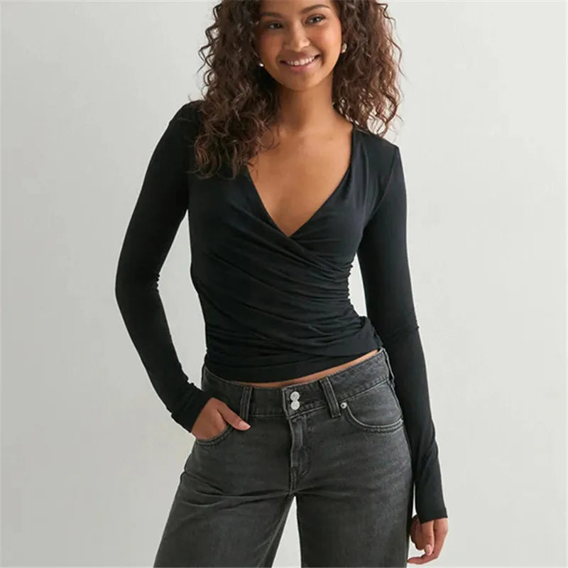 Fitted white layering tee paired with denim for classic minimal style