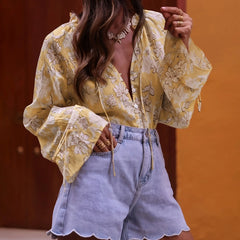 A full-length shot of a flare sleeve women's shirt styled for a casual day out.