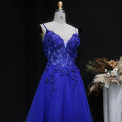 Formal tulle gown with embellished bodice and softly draped full skirt