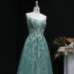 Formal tulle gown with embellished bodice and softly draped full skirt