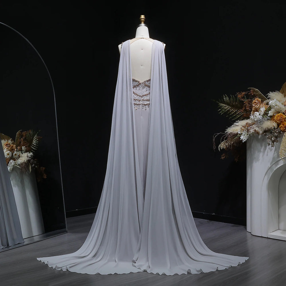 A-line tulle evening gown with round neckline and flowing skirt displayed on mannequin