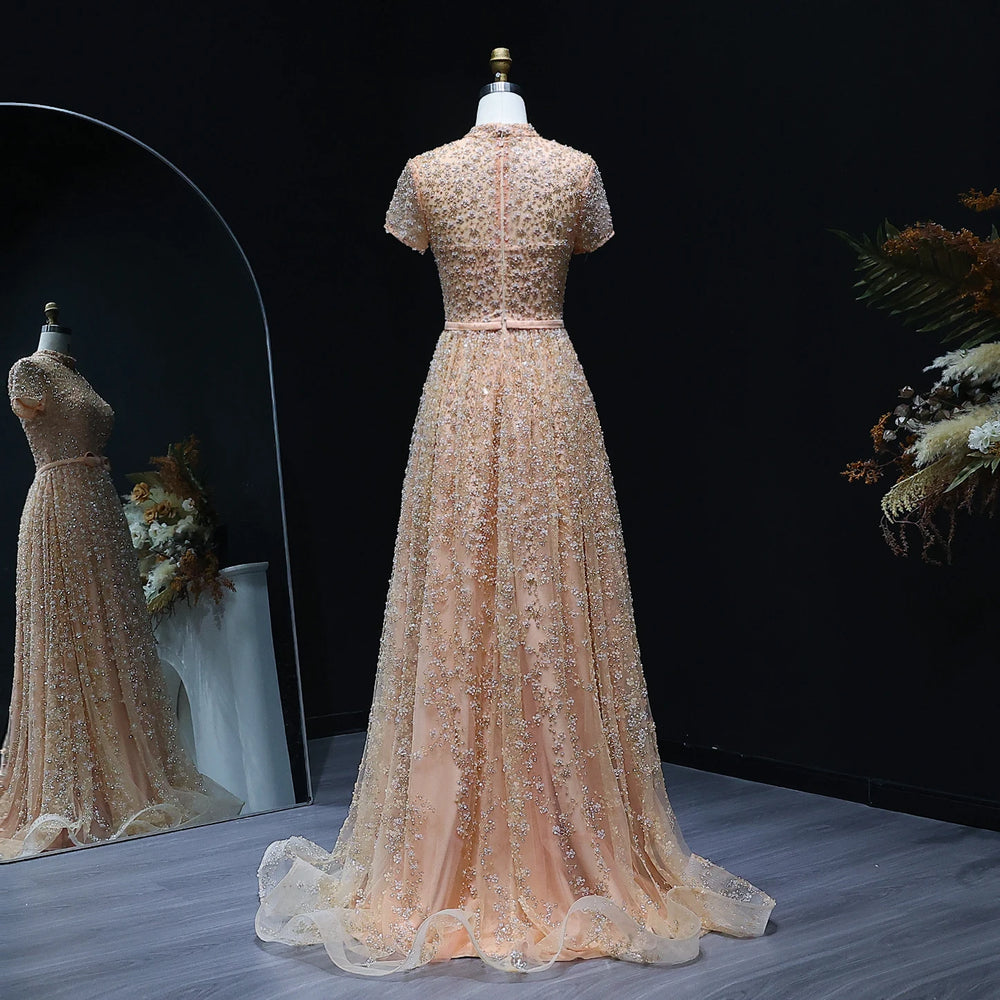Embroidered formal dress displayed on mannequin against dark background