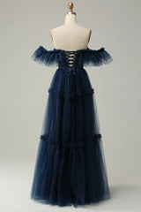 Elegant evening gown with sculpted waist and flared tulle hem