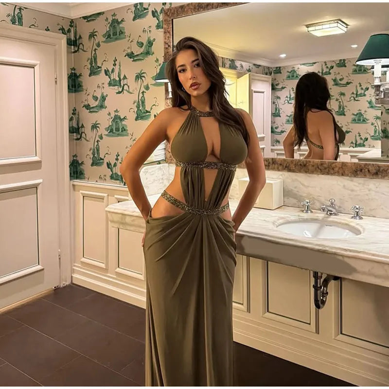 Full-length look of a brown-gold sequin evening maxi dress with halter neckline, captured in a refined indoor setting at night.