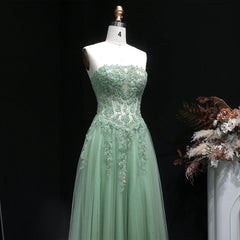 Floor-length A-line evening gown with textured appliqué detailing