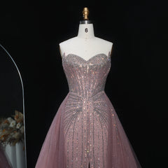 Sparkly floor-length trumpet gown designed for sophisticated evening events on a mannequin against a black background