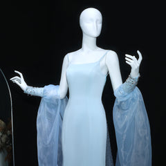 Full-length studio shot highlighting the fitted trumpet silhouette and floor-length hem of the light blue formal gown.