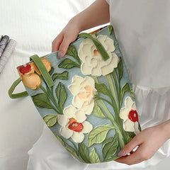 Floral canvas bucket shoulder bag in artistic design